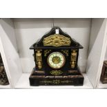 A large Victorian slate mantle clock.