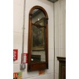 A Victorian mahogany arch topped mirror.