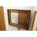 A decorative gilt framed mirror.