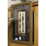 Two African figures, framed and glazed.