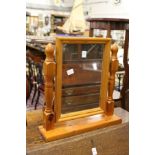 A modern pine dressing table mirror.