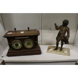 A combination clock, barometer and thermometer together with a cast metal figure of a musician.
