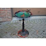 A metal bird bath.