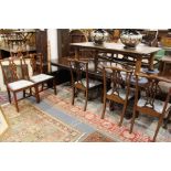 Two sets of six Georgian style mahogany dining chairs to include a pair of carver chairs.