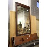 An unusual mahogany storage box and a mirror.