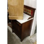 A Victorian walnut small marble top wash stand with tiled back splash.