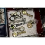 Various watches and watch parts.