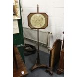 A Regency mahogany pole screen.