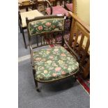 A pretty Victorian low armchair with painted decoration.