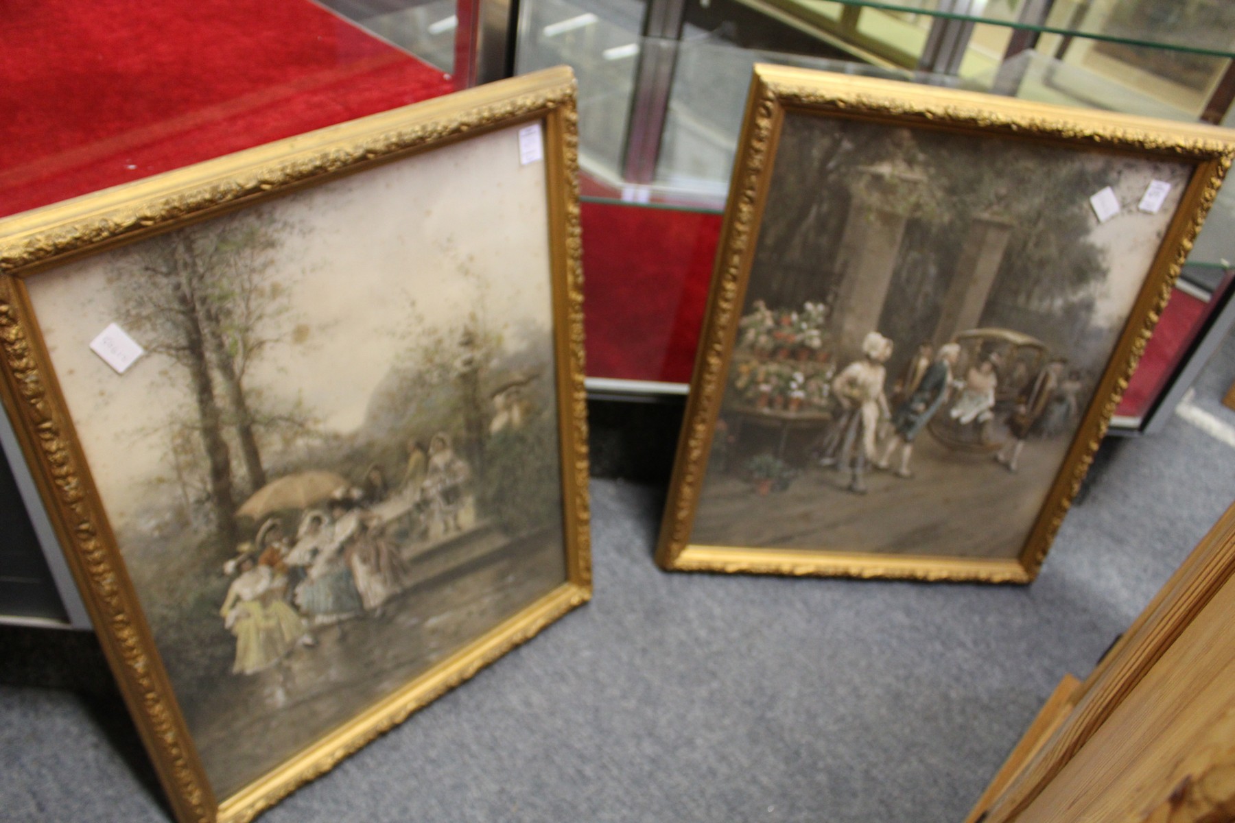 A pair of Regency scenes with figures, colour prints, in decorative gilt frames.