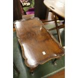 A walnut tray table.