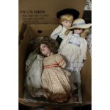 A late Victorian porcelain doll and other modern dolls.