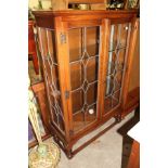 An oak two door display cabinet.