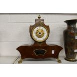 A decorative French mantle clock.