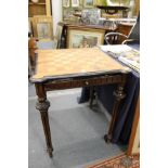 A continental walnut and ebonised gaming table.