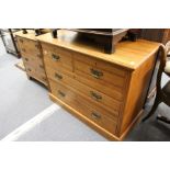 An Edwardian satin and walnut chest of drawers.