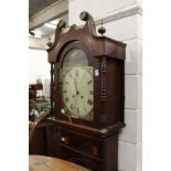 A 19th century mahogany eight-day long case clock with painted arched dial.