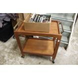 A teak two tier tea trolley.