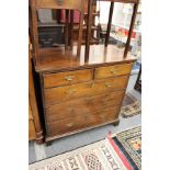 A George III oak chest of two short and three graduated long drawers on bracket feet.