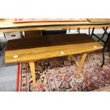 A 1970's teak coffee table.