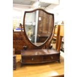 A shield shaped dressing table mirror.