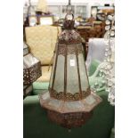 A decorative eastern style patinated metal hanging lantern.