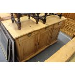 A pine dresser base with three drawers and three cupboard doors.