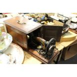 A cased Singer sewing machine.