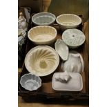 A small collection of jelly moulds and other kitchenalia.