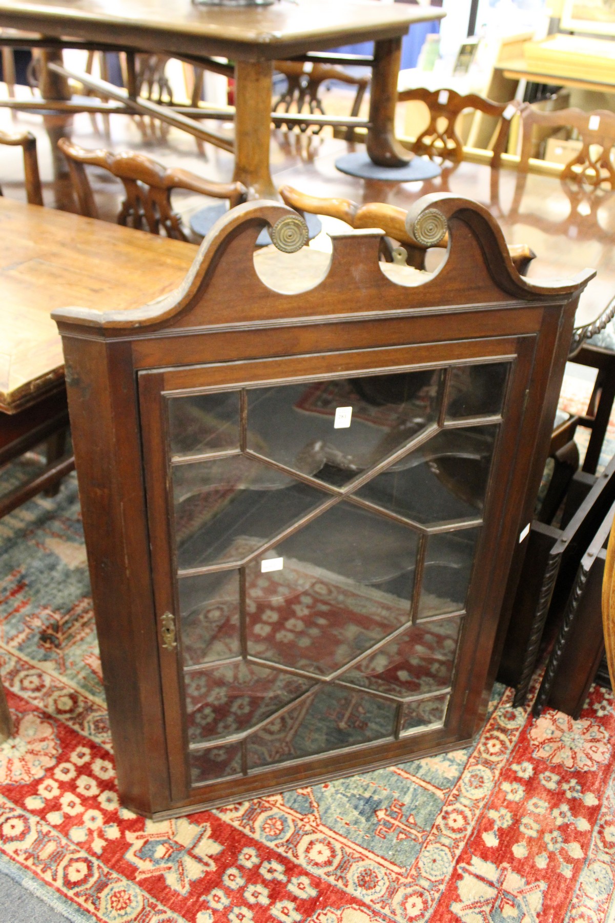 A George III design mahogany hanging corner cabinet.