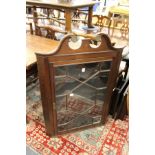 A George III design mahogany hanging corner cabinet.