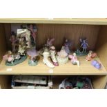Decorative resin models of fairies and similar items.