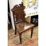 A Victorian mahogany hall chair.