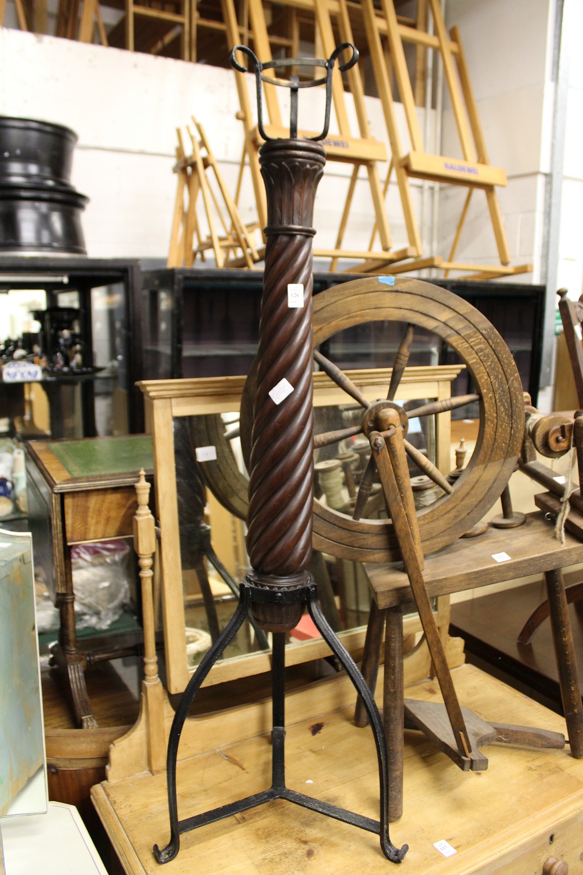 A decorative mahogany and wrought iron stand.