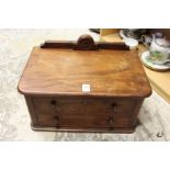 A small mahogany two drawer table top chest.