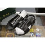 A pair of Louis Vuitton men's black patent crocodile sandals.