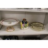 A floral decorated porcelain tazza, a Staffordshire figure group and a creamware chestnut basket and