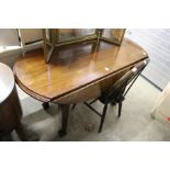 A modern drop leaf dining table.