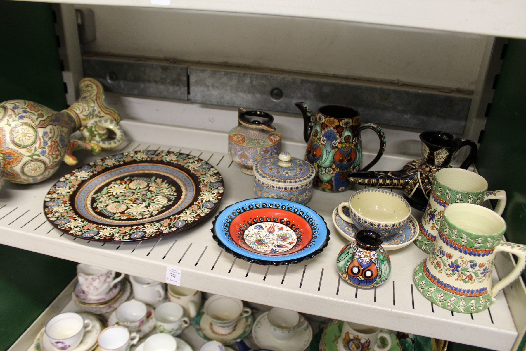 A quantity of Swiss Thoune decorative pottery items to include a ewer, various mugs, plates etc.