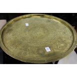 An eastern engraved brass circular tray table.