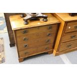 A small mahogany four drawer chest.