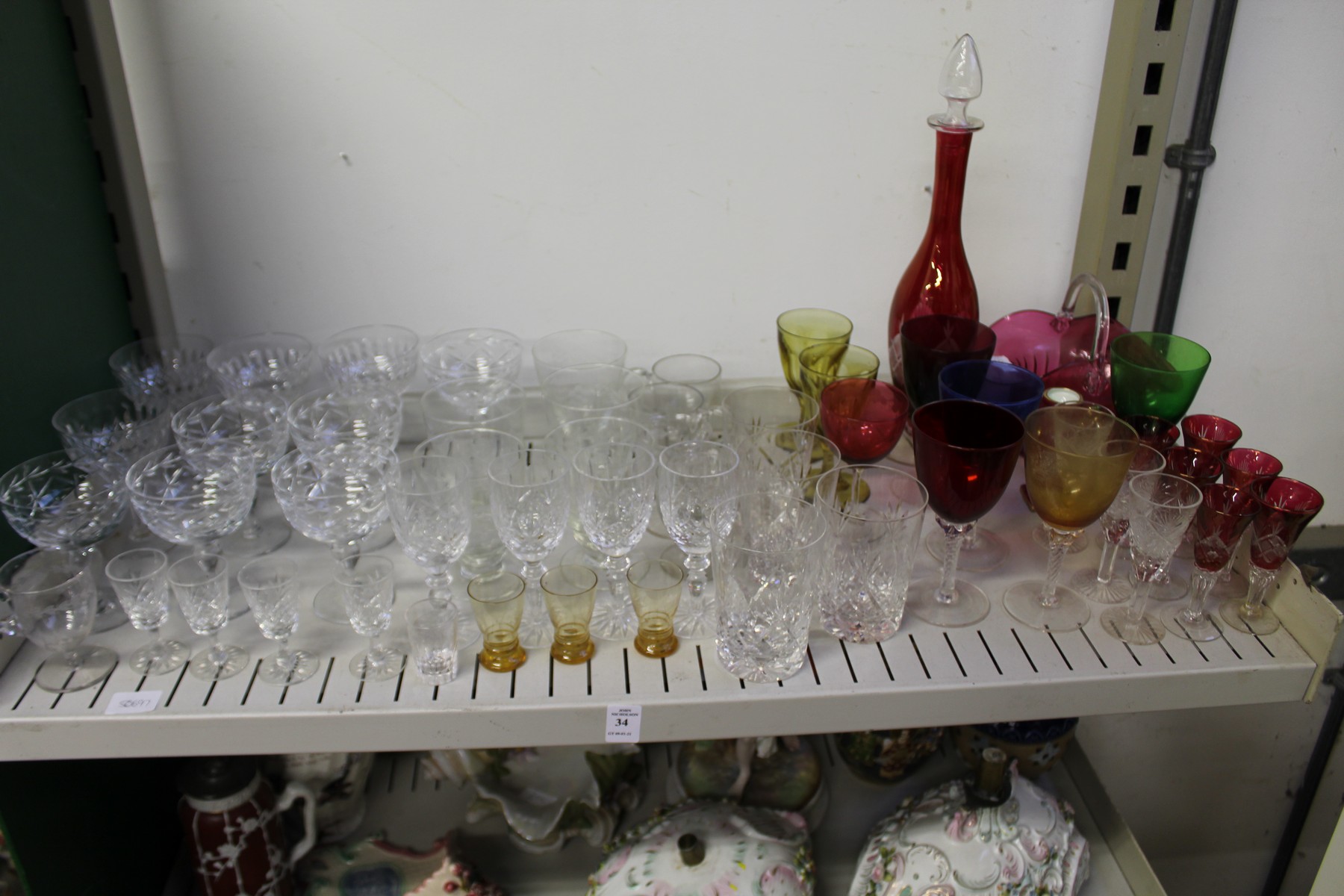 Cut glass champagne glasses, colourful glassware etc.