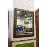A decorative gilt framed mirror.