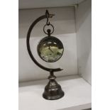 A novelty hanging clock / compass.