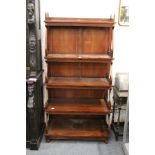 A reproduction hardwood waterfall bookcase.