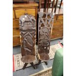 Two carved African hardwood chairs.