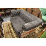 A modern Chesterfield style settee.