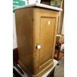 A Victorian pine pot cupboard with later marble top.