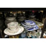 A large shelf of decorative china, glassware etc.