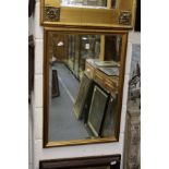 A gilt framed mirror.